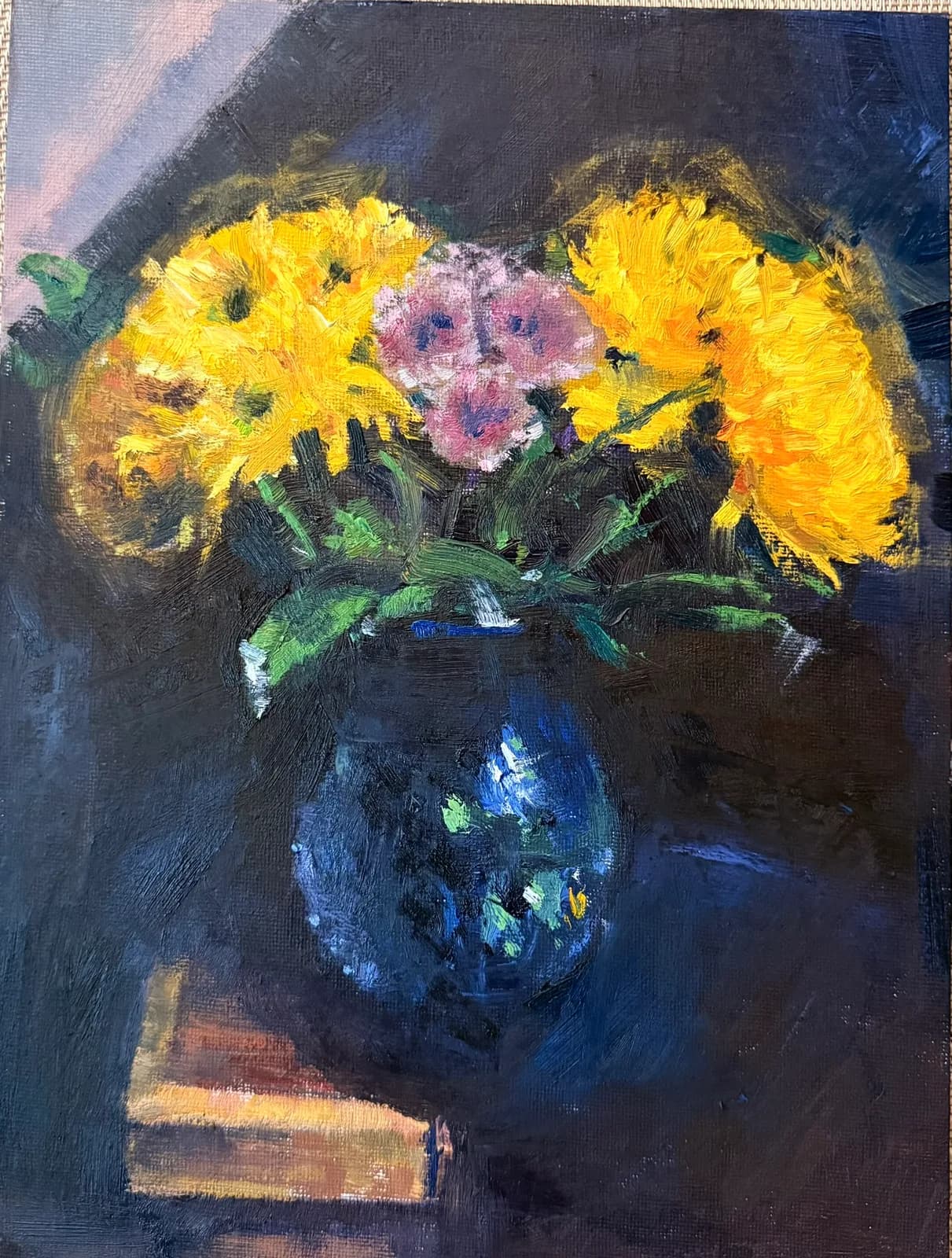 Impressionistic oil painting of yellow and pink flowers in a blue vase, with a dark background.